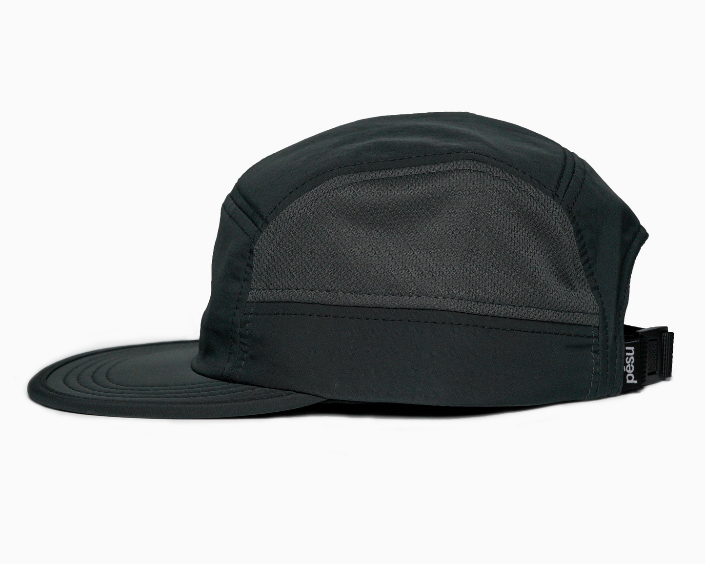 Pēsu charcoal lightweight performance 8 panel cap with breathable mesh panels, quick-dry fabric, moisture-absorbing sweatband and minimalist design for sport and lifestyle. Logo detail on black back buckle. 