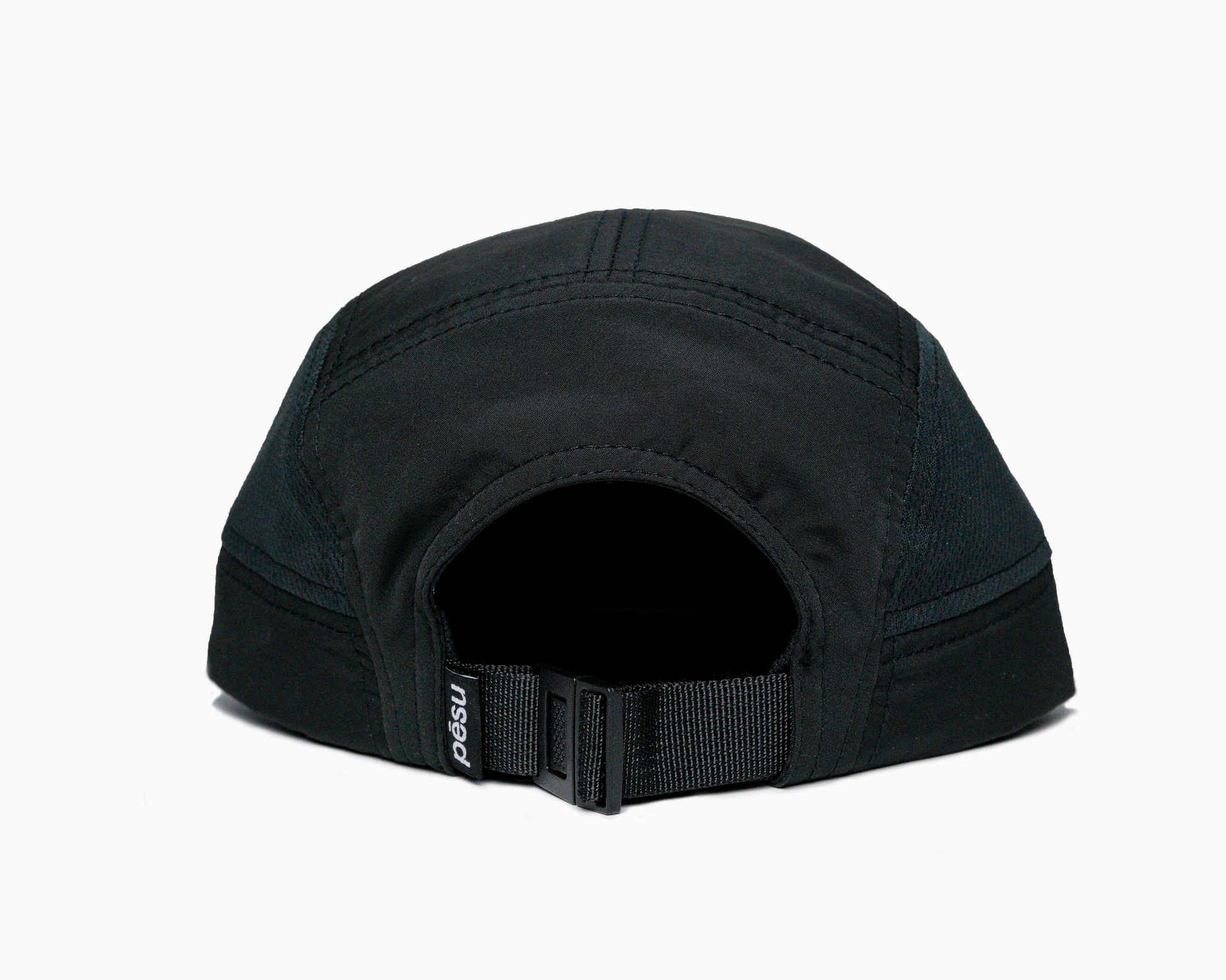 Pēsu black lightweight performance 8 panel cap with breathable mesh panels, quick-dry fabric, moisture-absorbing sweatband and minimalist design for sport and lifestyle. White pēsu box logo on frontpanel. Logo detail on black back buckle. 